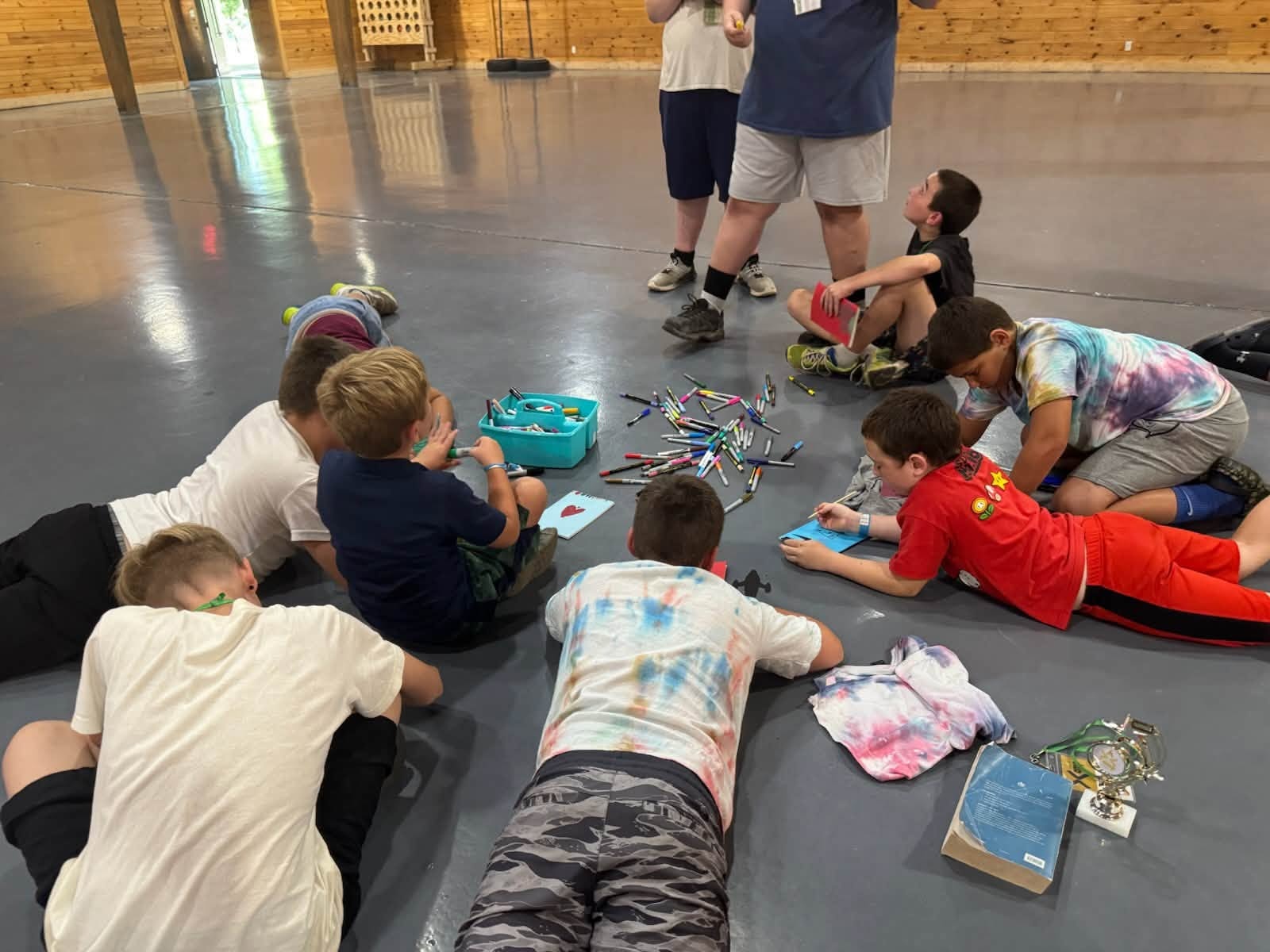 Small group of campers covered in color powder