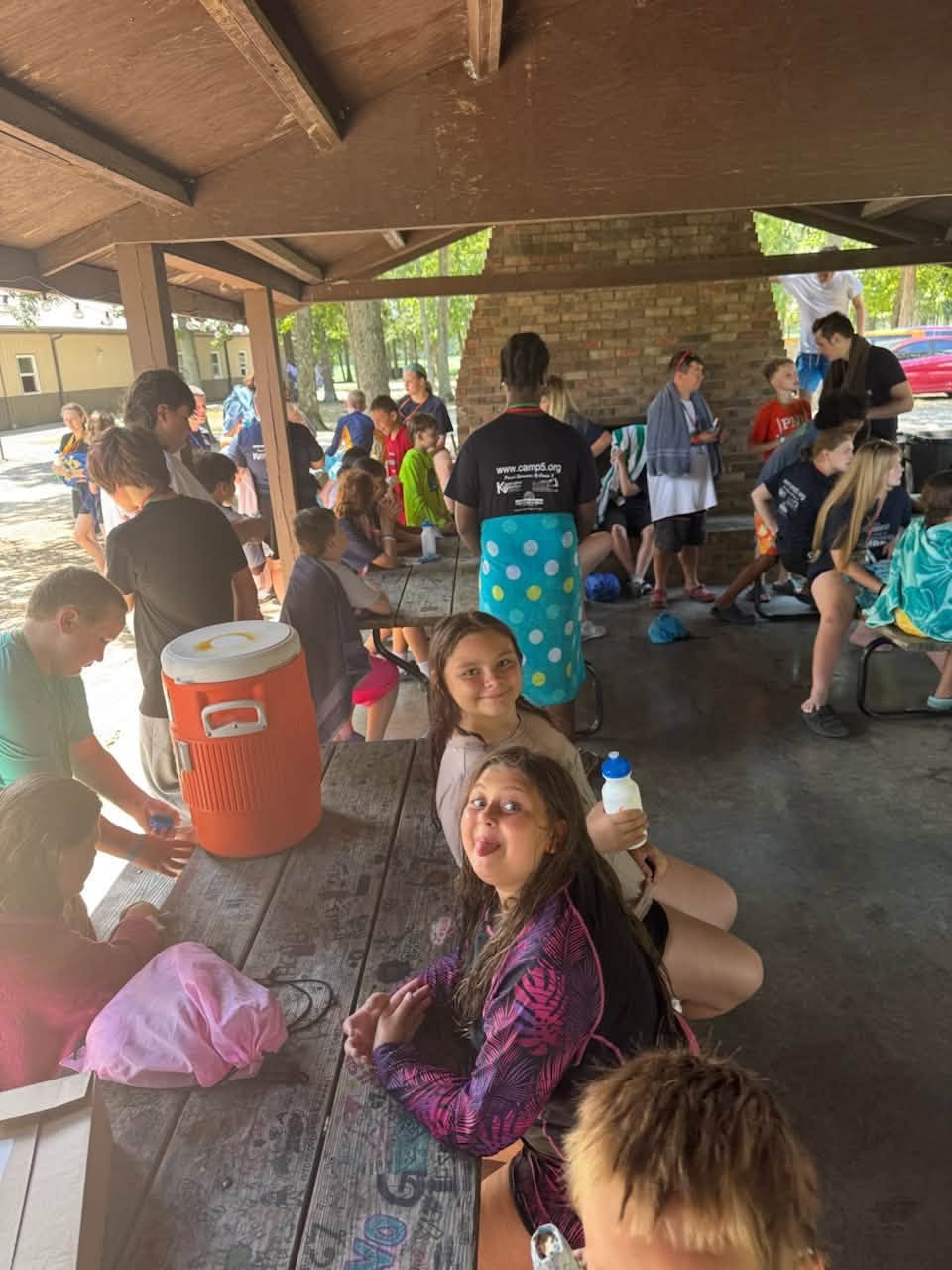 Campers dancing at the glow party with light-up headphones