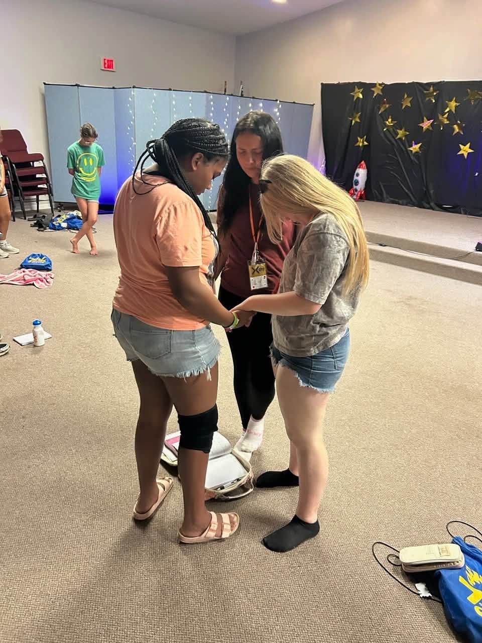 Campers praying together at Greater Camp
